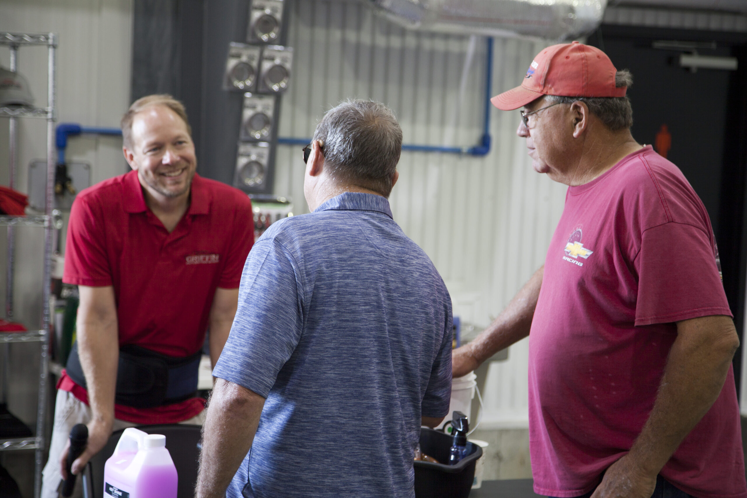 Scott talking with two guys Careers